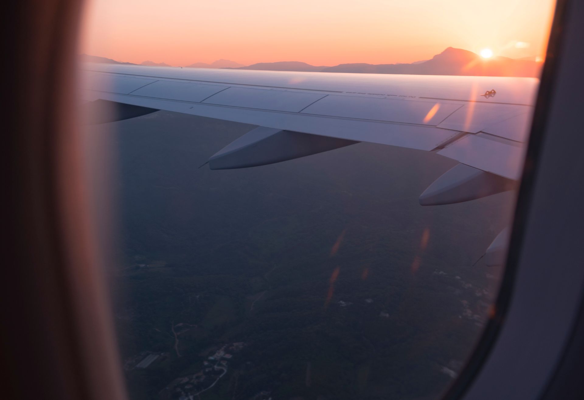 Photograph of an aeroplane flying above clouds